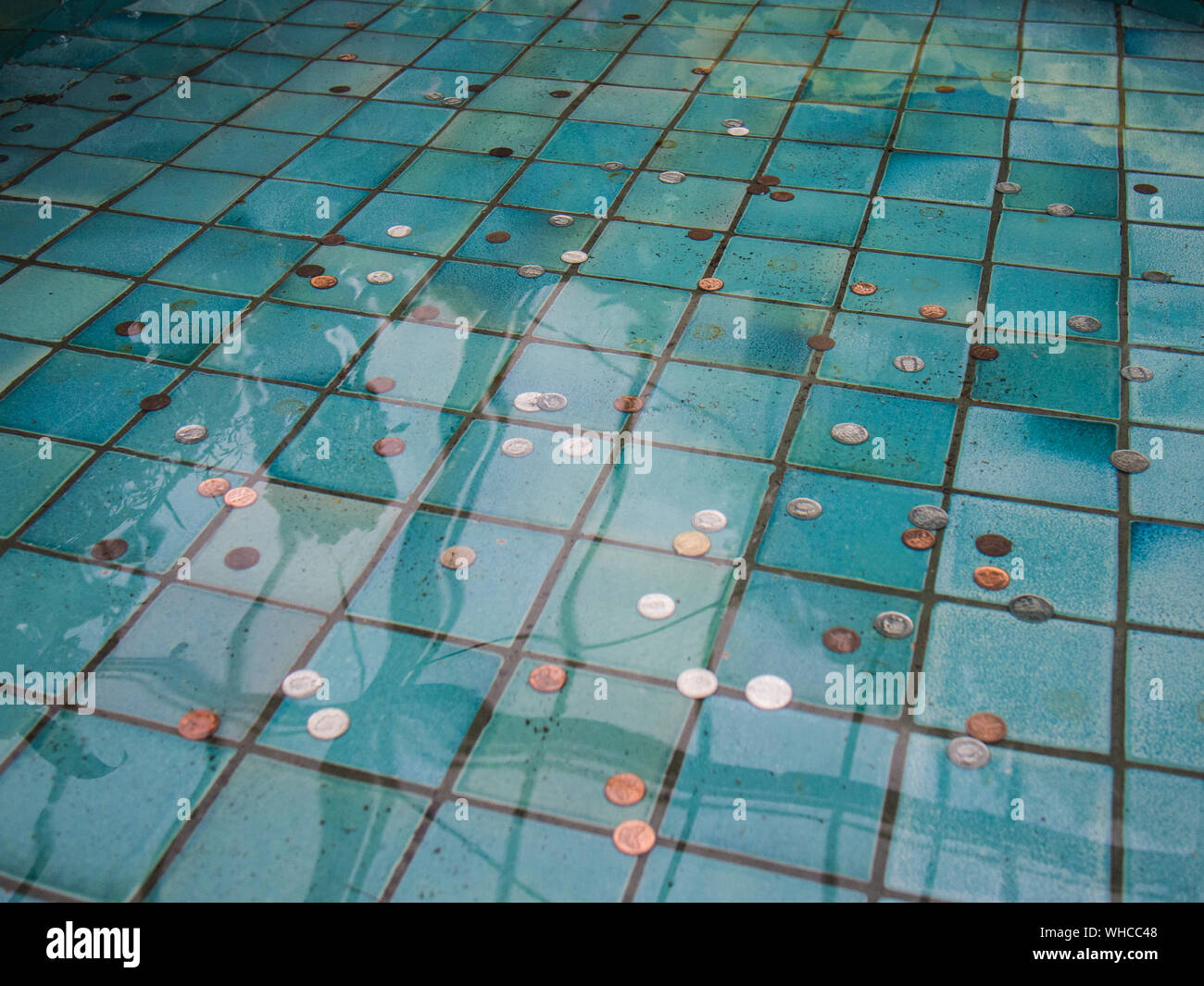 https://c8.alamy.com/comp/WHCC48/coins-in-wishing-pond-WHCC48.jpg