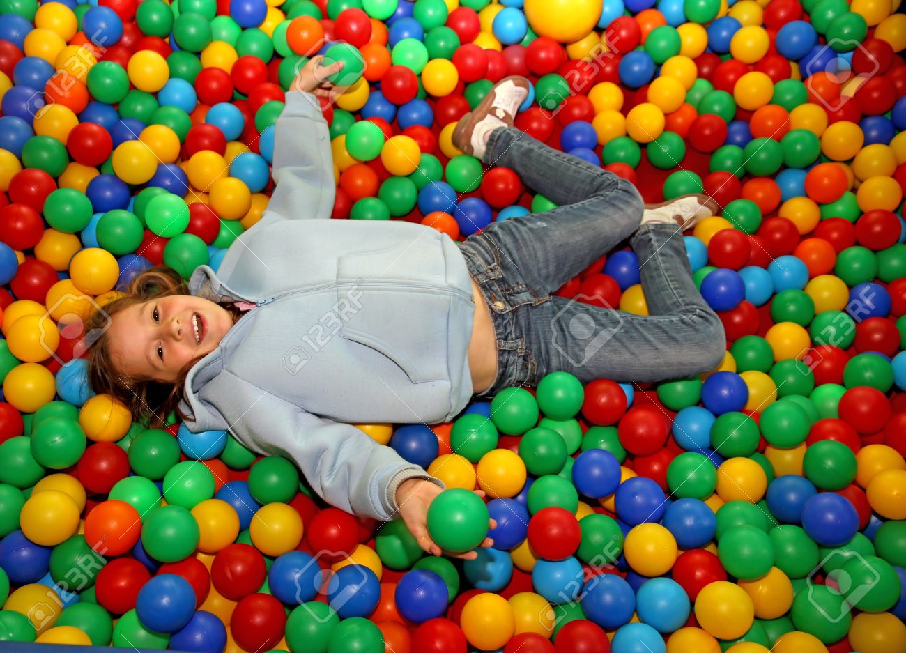 31392404-beautiful-little-girl-play-dipped-in-colored-balls-of-kindergarten-pool.jpg